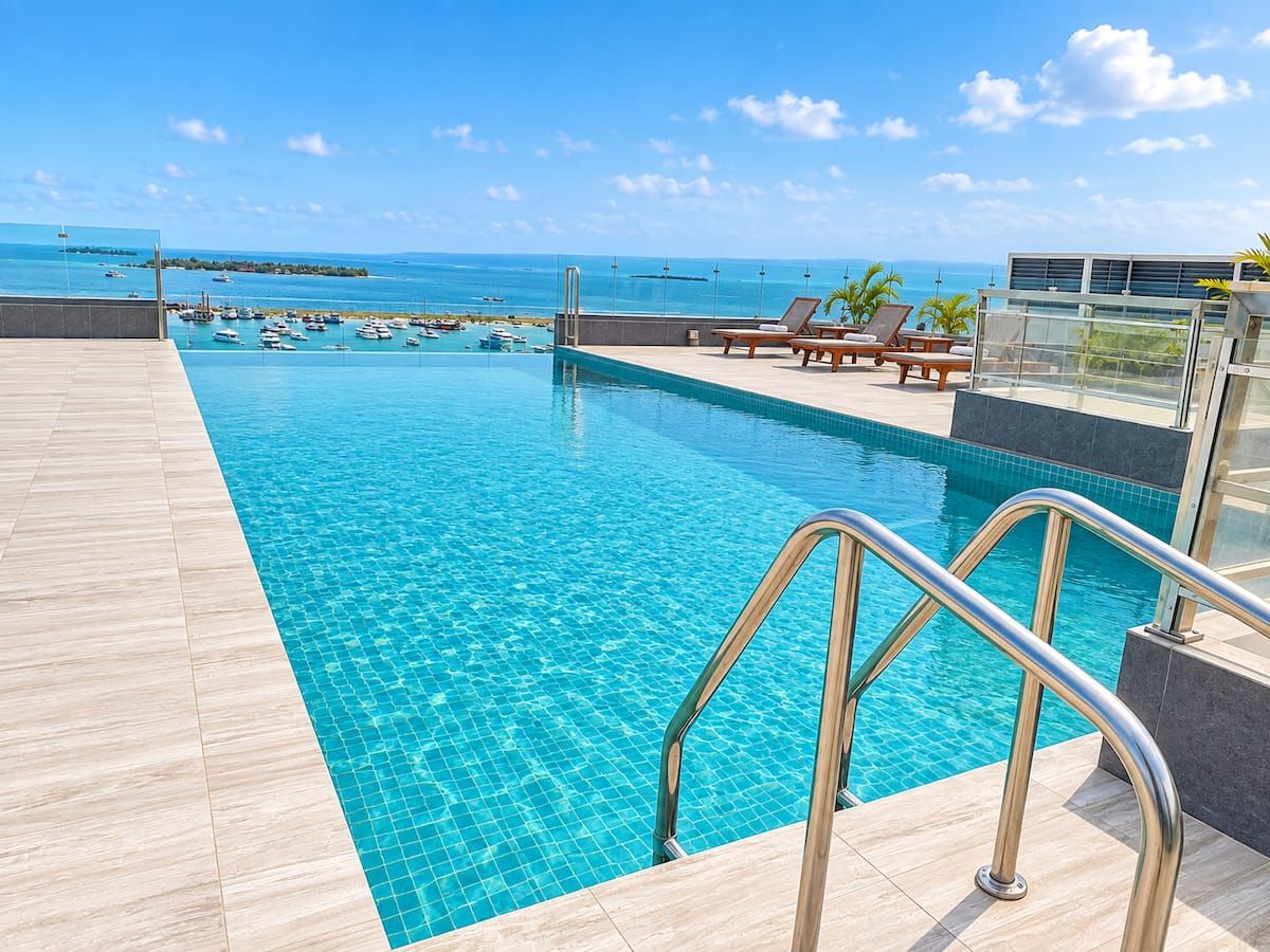 Swimming pool on the building rooftop overlooking the sea